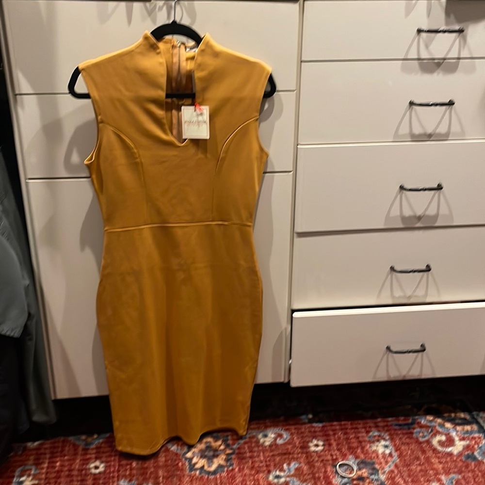 Cocktail dress brand new with tags. Fitted to your body.